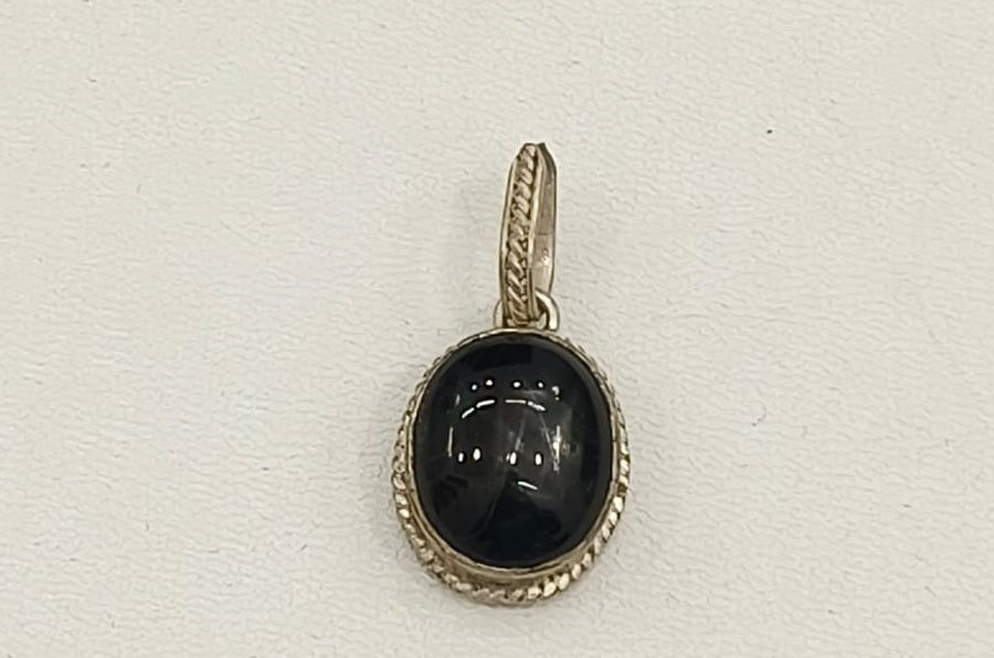 10.50/GM BLACK STAR SILVER PENDANT  (525.00)